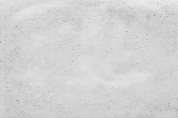 Cardboard white texture close-up. Light old paper background. Grunge concrete wall. Vintage blank wallpaper.