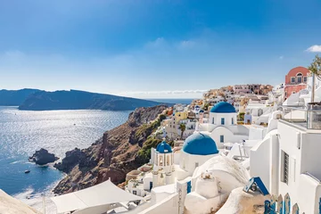 Fototapeten Amazing summer landscape, luxury vacation. Oia town on Santorini island, Greece. Traditional and famous houses and churches with blue domes over the Caldera, Aegean sea © icemanphotos