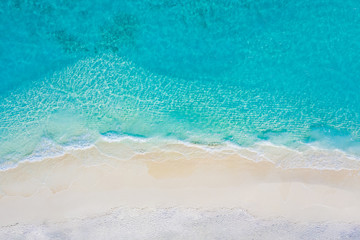 Summer seascape beautiful waves, blue sea water in sunny day. Top view from drone. Sea aerial view,...