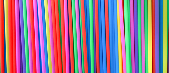 Obraz premium colored straws for drinks, texture, top view
