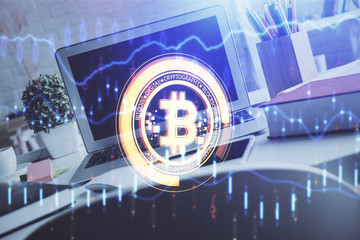 Multi exposure of blockchain and crypto economy theme hologram and table with computer background....