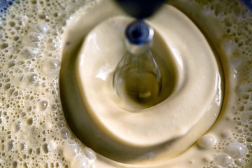 pancake crepe mix inside metal bowl closeup
