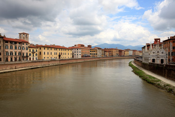 Fototapeta na wymiar Pisa (PI), Italy - June 10, 2017: View of Arno river, Pisa, Tuscany, Italy, Europe