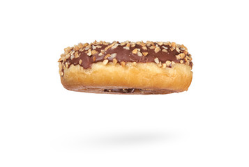 A single chocolate glazed donut with nuts isolated