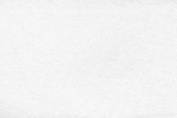 Cardboard white texture close-up. Light old paper background. Grunge concrete wall. Vintage blank wallpaper.