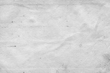Fototapeta premium Cardboard white texture close-up. Light old paper background. Grunge concrete wall. Vintage blank wallpaper.
