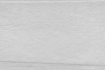 Cardboard white texture close-up. Light old paper background. Grunge concrete wall. Vintage blank wallpaper.