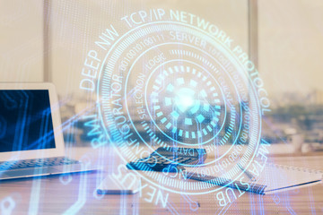 Double exposure of desktop computer and technology theme hologram. Concept of software development.