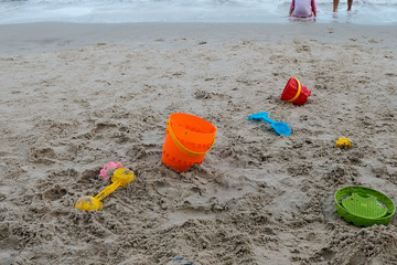 Fototapeta na wymiar toys on the beach and sand