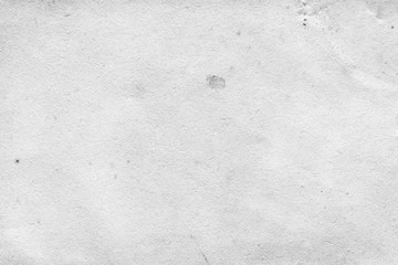 Cardboard white texture close-up. Light old paper background. Grunge concrete wall. Vintage blank wallpaper.