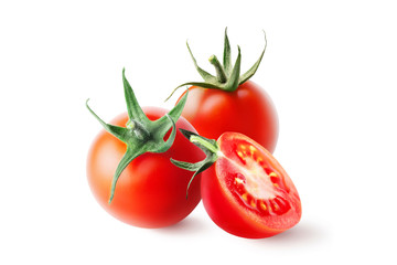 Whole and cut fresh, red tomatoes with green steam isolated on white background. 