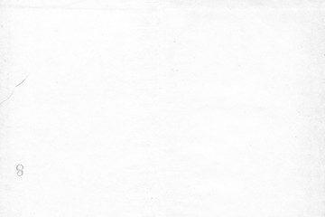 Cardboard white texture close-up. Light old paper background. Grunge concrete wall. Vintage blank wallpaper.