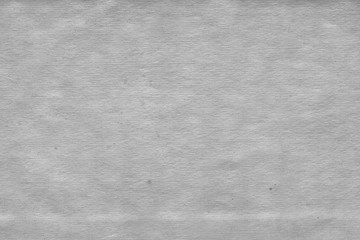 Cardboard white texture close-up. Light old paper background. Grunge concrete wall. Vintage blank wallpaper.