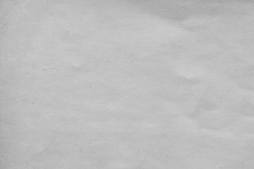 Cardboard white texture close-up. Light old paper background. Grunge concrete wall. Vintage blank wallpaper.