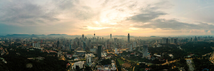 Panorama cityscape view in the middle of Kuala Lumpur city center during sunrise. Kuala Lumpur, MALAYSIA