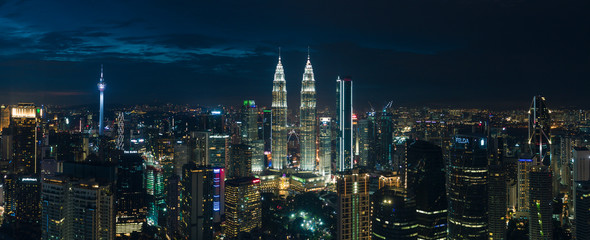 Aerial night view by drone of buildings and landmarks centre Kuala Lumpur city.