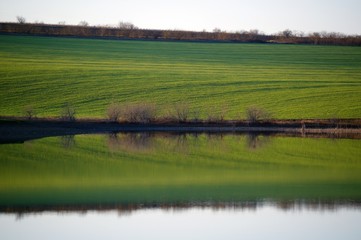 Clear reflection of the shore on the lake