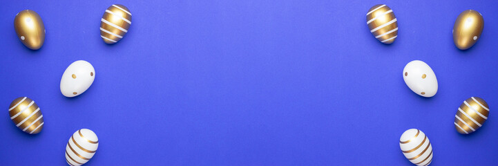 Easter basket with golden shine decorated eggs isolated on blue background. for you poster or flyer