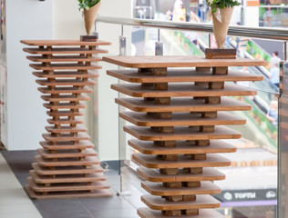 Wooden tables drawn from parallel wooden plates