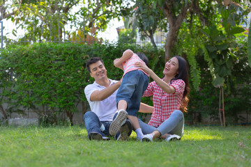 happy family playing in the garden