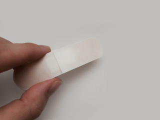 patch in hand on a white background.