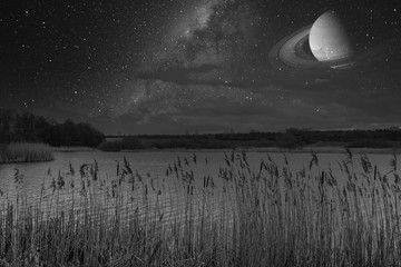 above  lake is the clear starry sky with the Milky Way and Saturn