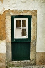 Old and colorful green wooden door