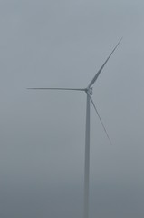 Windmill on the field. Production of energy from wind. Renewable resources. New technologies and...