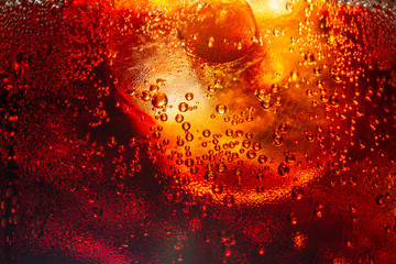 Background of cola with ice and bubbles. Side view background of refreshing cola flavored soda with carbonated with vintage tone