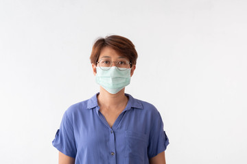 Aseptic medical mask of an Asian woman protected on her face, hands, stopped working without signs Air pollution, viruses, the concept of the spread of the corona virus