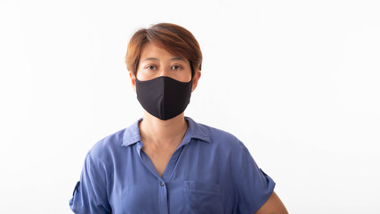 Aseptic medical mask of an Asian woman protected on her face, hands, stopped working without signs Air pollution, viruses, the concept of the spread of the corona virus