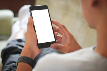 Cropped shot view of man hands holding smart phone with blank copy space screen for your text message or information content, female reading text message on cell telephone during in urban setting.