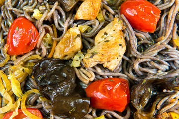 Rice noodles with slices of chicken, eggplant and red pepper