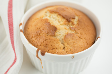 Homemade pastries: cupcake in round ceramic shape decorated with linen towel