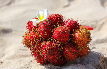 Rambutan fruit on the sand