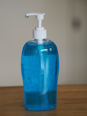 pressing a pump bottle, Hand Sanitizer, gel alcoholic mixture with gelatin in clear Plastic bottle, washing clean dirty to prevent germs protect colona virus, covid 19