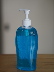 pressing a pump bottle, Hand Sanitizer, gel alcoholic mixture with gelatin in clear Plastic bottle, washing clean dirty to prevent germs protect colona virus, covid 19