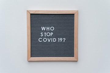 Who Stop Coronavirus. Covid-19 warning concept banner. Flat lay felt board coronavirus typography...