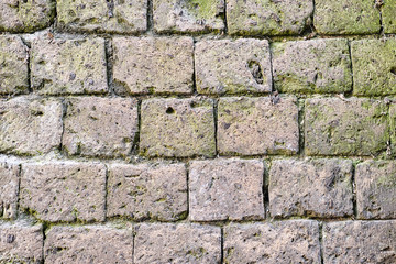 Background form a historic wall made of natural stones