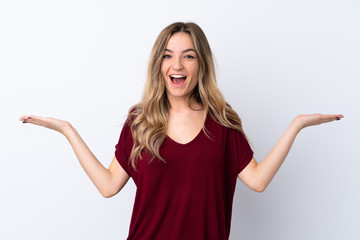 Young woman over isolated white background with shocked facial expression