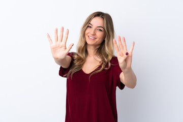 Young woman over isolated white background counting nine with fingers