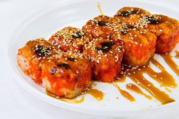 Japanese rice rolls sprinkled with syrup and sprinkled with sesame seeds