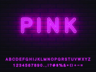 Realistic nice bright pink neon font set with transparent light on a brickwall background. collection of letters numerals icons signs symbols for advertising graphic and web design