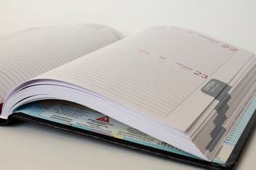 Black leather notebook on white background