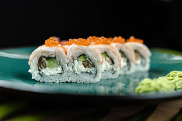 japanese sushi food. Maki ands rolls with tuna, salmon, shrimp, crab and avocado. Top view of sushi.