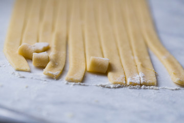Preparation of Easter cake, also called Pastiera Napoli, typical homemade dessert, with eggs, flour, sugar and vanilla, wheat and colored sugared almonds