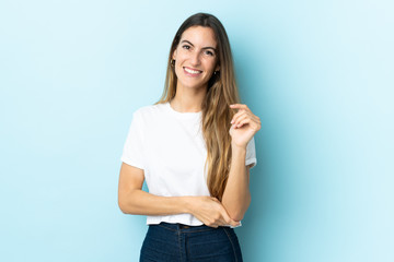 Young caucasian woman over isolated background laughing