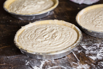 Preparation of Easter cake, also called Pastiera Napoli, typical homemade dessert, with eggs, flour, sugar and vanilla, wheat and colored sugared almonds