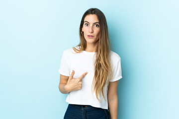 Young caucasian woman over isolated background pointing to oneself