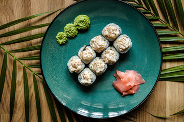 Fototapeta na wymiar japanese sushi food. Maki ands rolls with tuna, salmon, shrimp, crab and avocado. Top view of sushi.